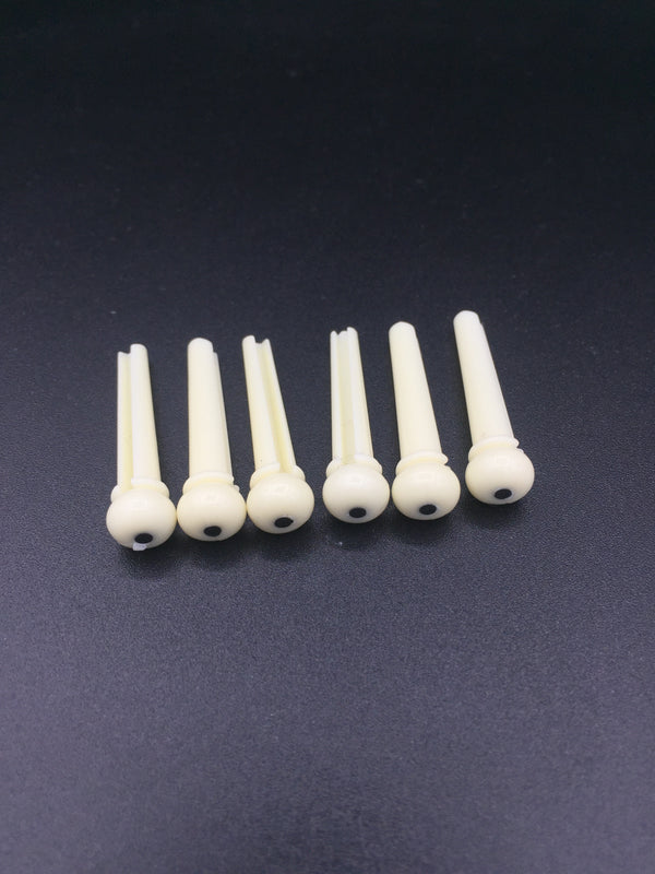 หมุดยึดสายกีตาร์โปร่งพลาสติก มีจุด